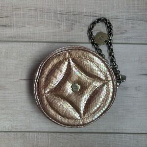 The ERIC JAVITS Snake Embossed Leather Round Wristlet Clutch Bag